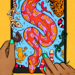 Reptiles and amphibians also known as herps seemingly coming out of an iPad.